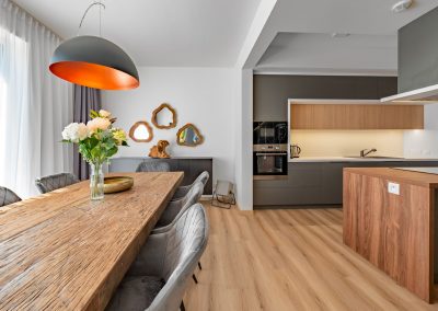 View of the massive dining table and kitchen counter